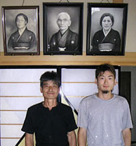 Igarashi and his son in front of ancestors' picture
